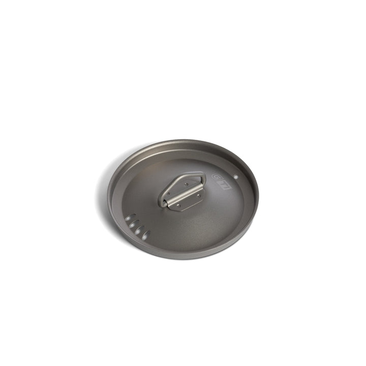 GeoPress® Titanium Cook and Straining Lid laying flat on white background