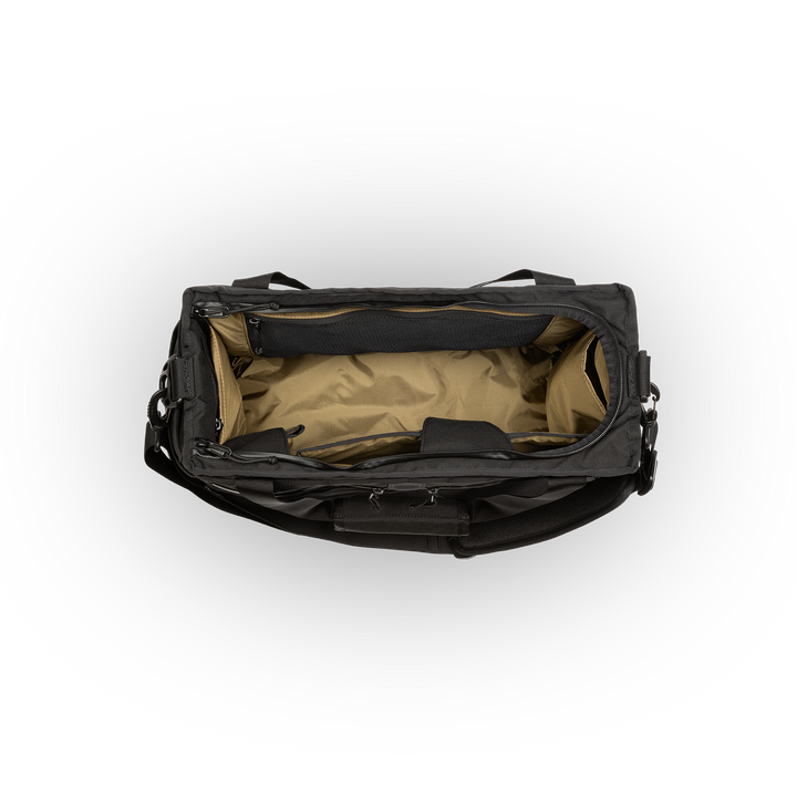 32L Mission Hauler Tote (Covert Black) with main compartment open showing Coyote interior and pockets on a white background / Covert Black