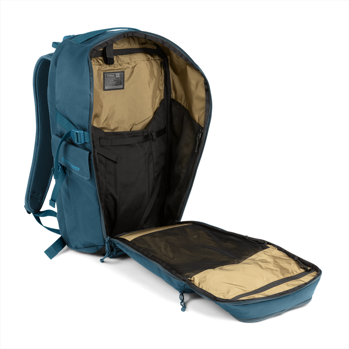 30L Transport Backpack (Wander Blue) with open compartment showing Coyote interior on a white background / Wander Blue