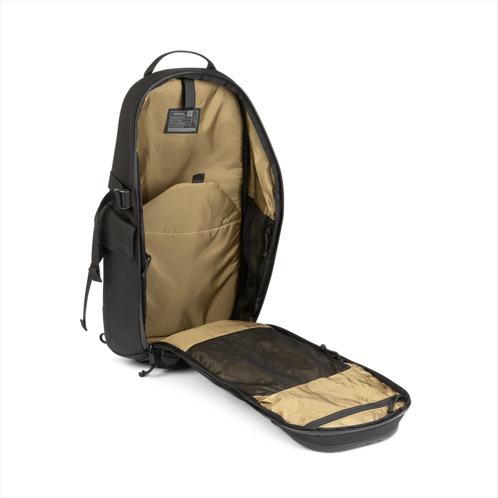 18L Transport Sling Daypack (Covert Black) with open compartment showing Coyote interior on a white background / Covert Black
